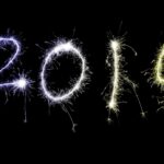 Festive multicolored sparkling 2019 New Year date with fiery trails lighting up the night sky with copy space for your seasonal holiday greeting